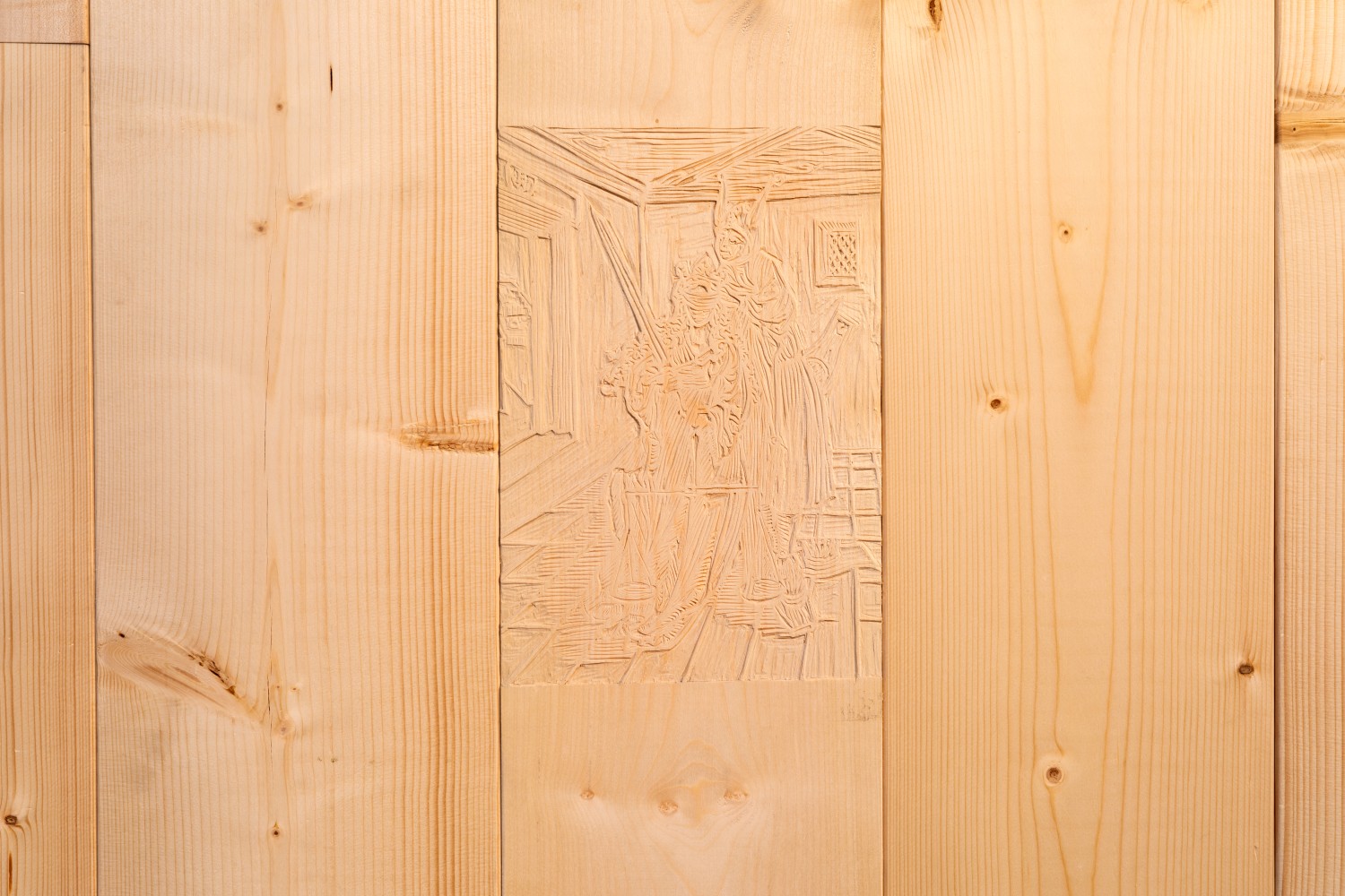 Die Arbeit mit dem Titel "Narrenschiff" von Tyler Coburn ist eine Wandinstallation, die die vorherrschende Architektur der Ausstellungsräume durchbricht und in ein Spiel mit Vorder- und Rückseitigkeit eintritt. So zeigt sich erst auf den zweiten Blick ein in die WAnd integrierter Holzschnitt, der das Verhüllen der Augen der Göttin der Gerechtigkeit, Justitia, durch einen Narren zeigt. Es ist die Reproduktion eines Holzschnitts, der mutmaßlich von Albrecht Dürer gefertigt wurde und in dem erstmals 1494 von Sebastian Brant veröffentlichten Buch Narrenschiff als Illustration erscheint. Erst seit dem 16. Jahrhundert wird die Blindheit Justitia als Symbol für Neutralität wahrgenommen. Diese Darstellung, der ersten bekannten Darstellung von Justitia überhaupt, zeigt die Göttin der Gerechtigkeit geblendet von Spott und der Korruption des Gesetzes.